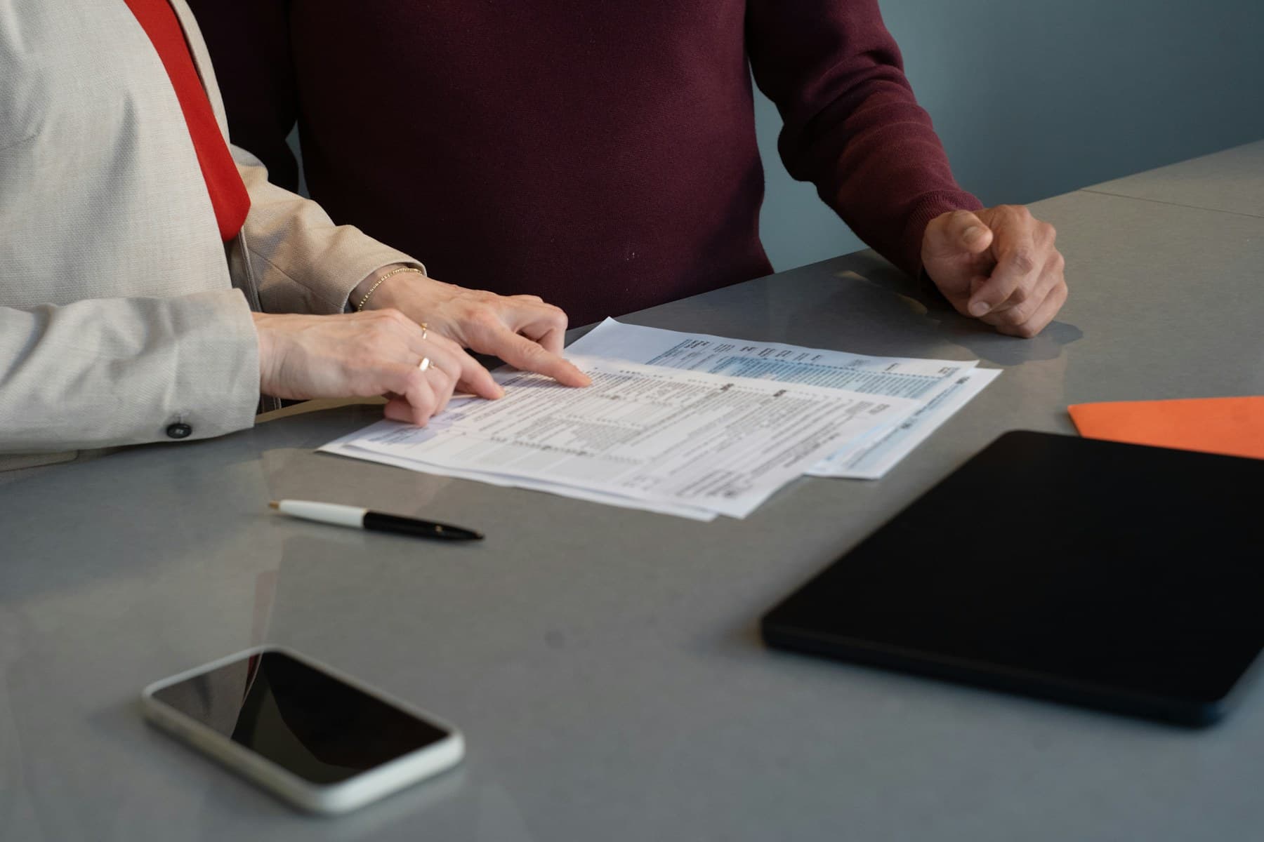 Advisor and client reviewing tax paperwork together
