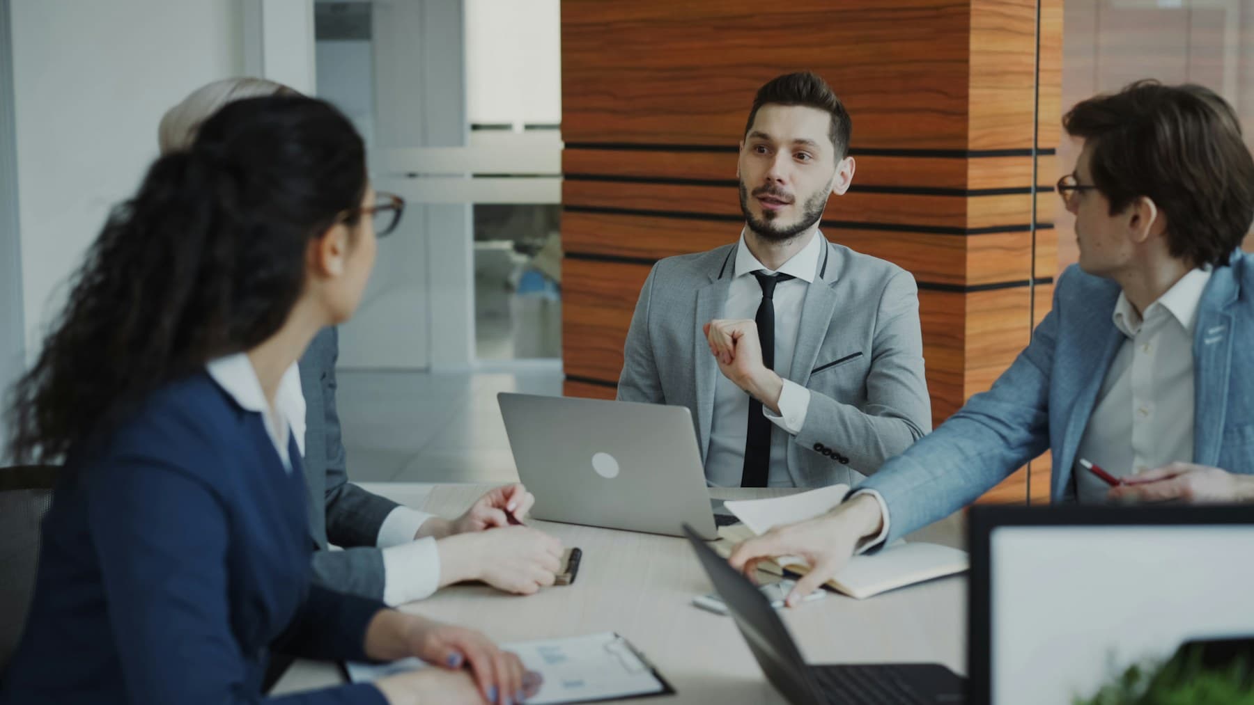Professionals collaborating during a financial planning meeting