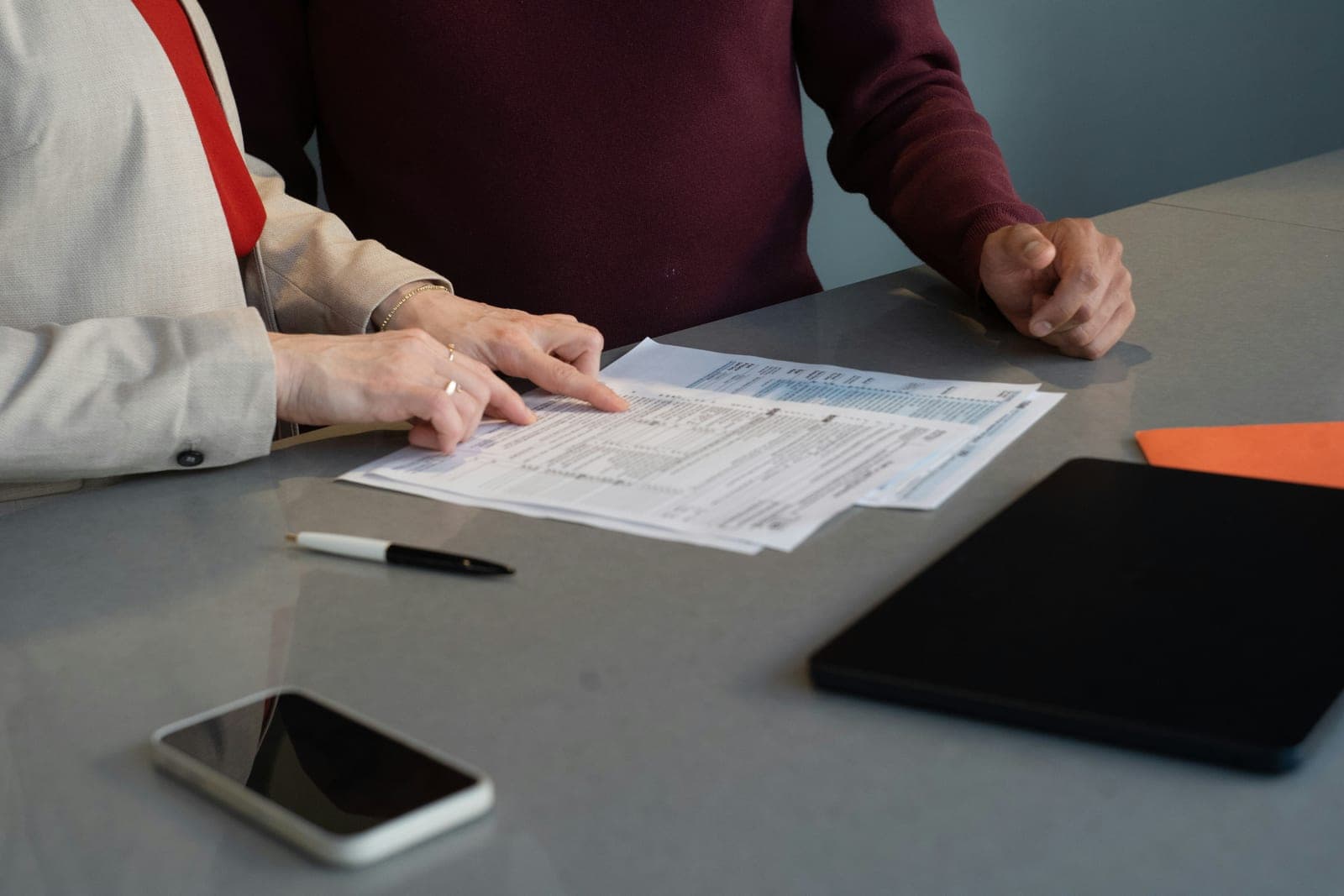 Professionals reviewing documents together at a table